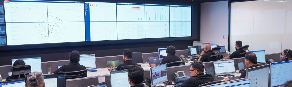 ZainTech NOC center with engineers monitoring managed cloud infrastructure